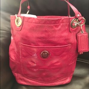 Hot pink patent leather embellished C Coach bag